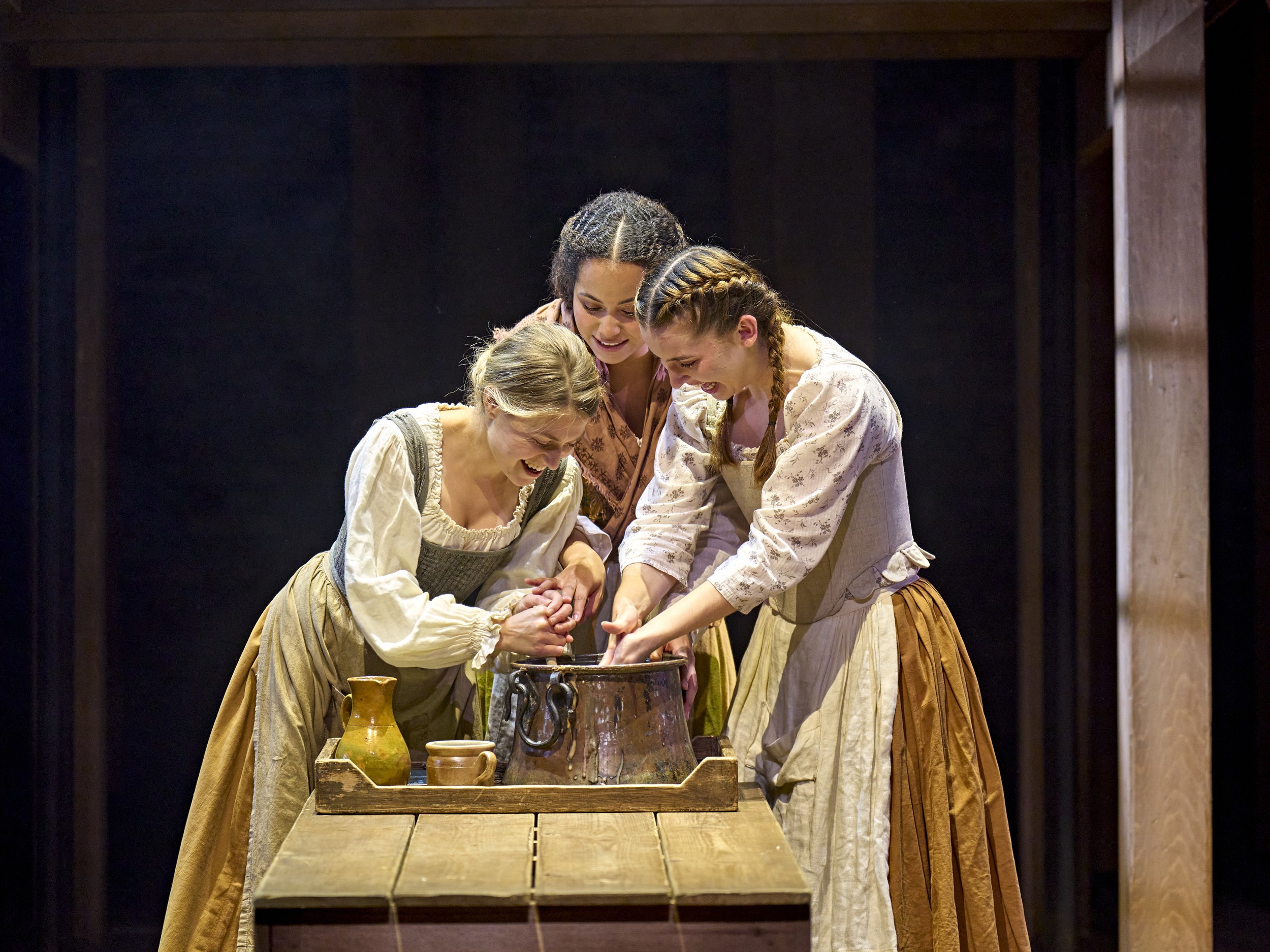 A diverse cast of actors performing a scene from Hamnet on stage in London.
