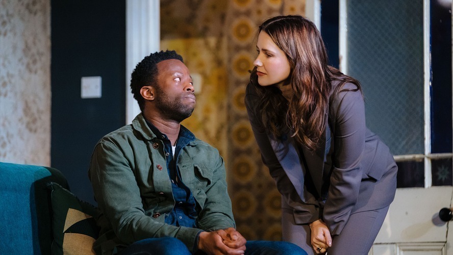 Sophia Bush as Lauren and Clifford Samuel as Sam in a dramatic scene from A Ghost Story.