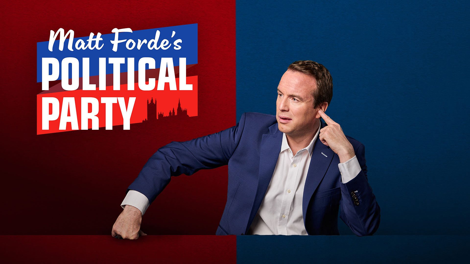Matt Forde, in a blue suit, gestures thoughtfully against a vibrant red and blue background.