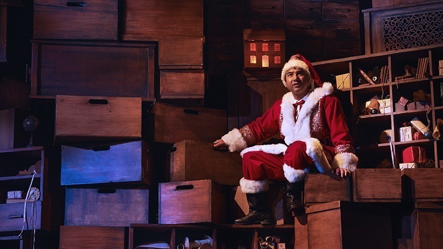 Matt Crockett performing in a theatrical scene from "A Christmas Carol (ish)", dressed in period costume.