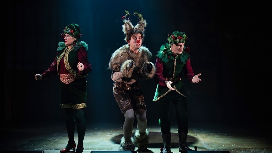 Matt Crockett performing in a theatrical production, dressed in period costume on stage.