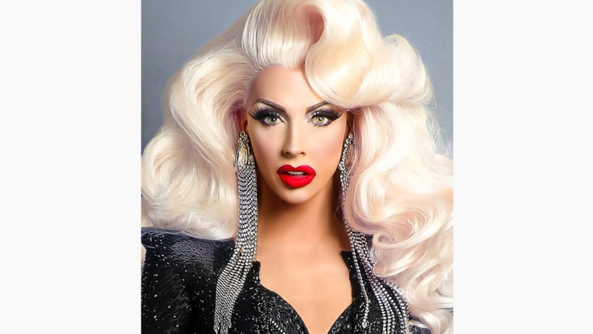 Alyssa Edwards poses confidently, wearing a vibrant, sequined outfit with bold makeup and styled hair.