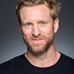 Adam Slynn as a character in Harry Potter and the Cursed Child, wearing wizard robes.