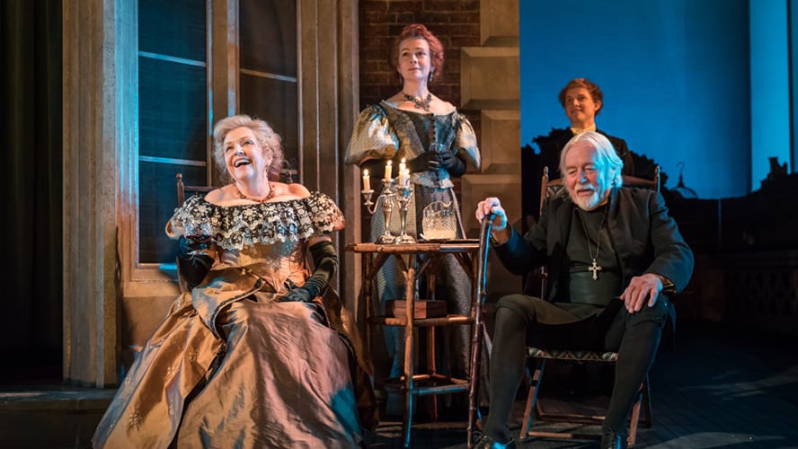 Anne Reid as Lady Hunstanton, Emma Fielding as Mrs Allonby, William Gaunt as Rev Daubney, and Harry Lister-Smith as Gerald Arbuthnot in a theatrical scene.