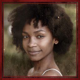 Smiling woman with curly hair, wearing a white top, framed by a red border, blurred background.