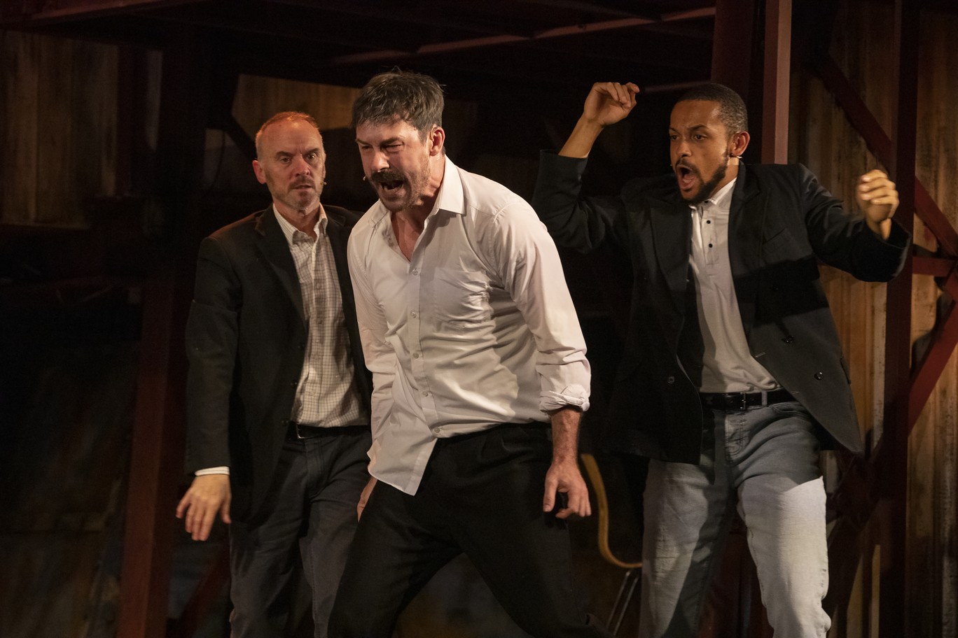 Mark Womack, Barry Sloane, and Aron Julius perform in a dress rehearsal at Royal Court Theatre.