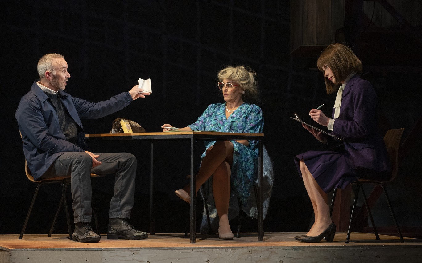 Mark Womack, Helen Carter, and Lauren O'Neil rehearsing on stage at the Royal Court Theatre.