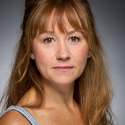 Claire Lams portraying a character in Harry Potter and the Cursed Child, wearing a costume and makeup.