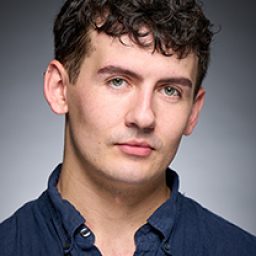 Conor Quinn as a character in Harry Potter and the Cursed Child, wearing wizarding robes.