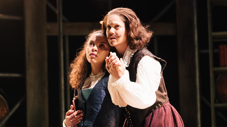 A stage scene from "Emilia" at Vaudeville Theatre, featuring actors in period costumes and dramatic lighting.