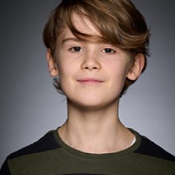 Ethan Webster as a character in Harry Potter and the Cursed Child, wearing wizard robes.