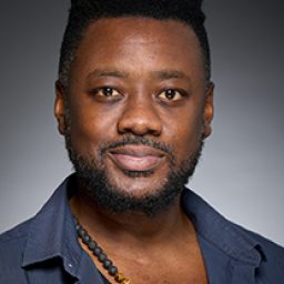 Gabriel Fleary as a character in Harry Potter and the Cursed Child, wearing wizard robes.