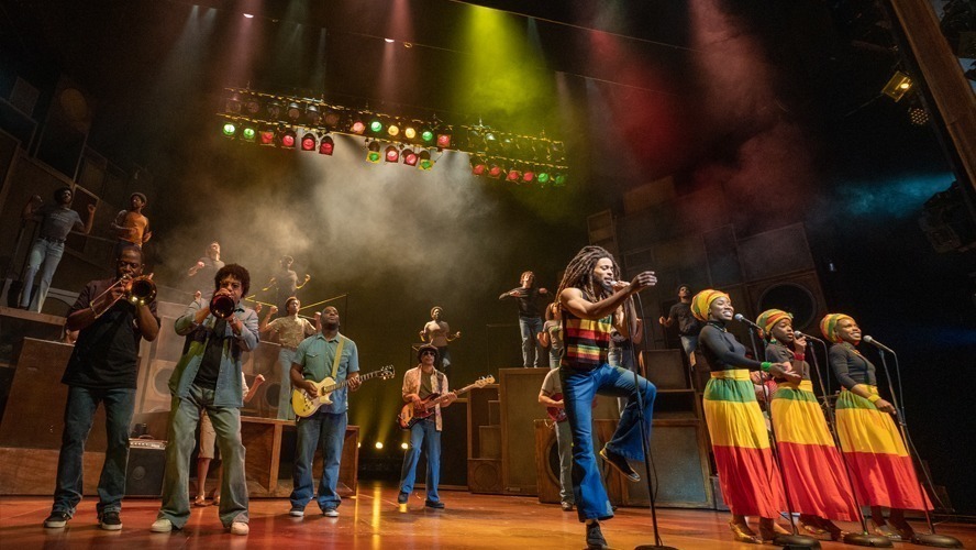 A vibrant stage scene from "Get Up, Stand Up" at the Lyric Theatre, March 2022.
