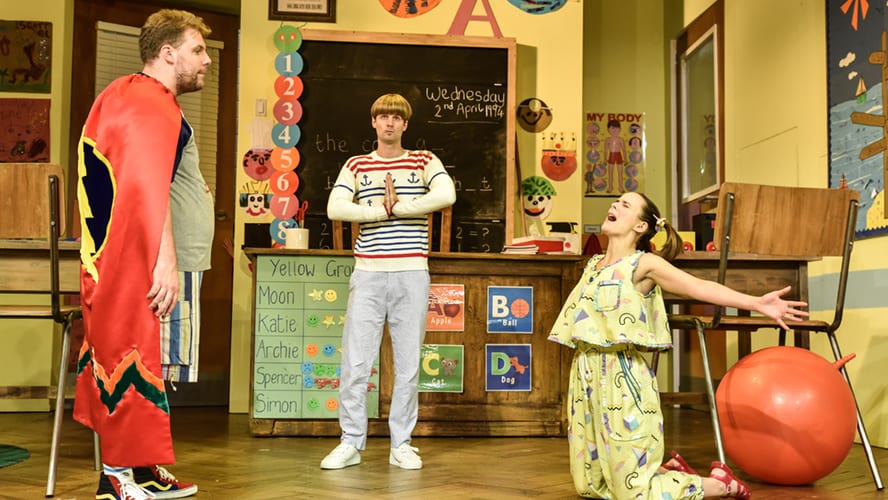 A lively stage performance at the Vaudeville Theatre, featuring actors in colourful costumes and dramatic lighting.