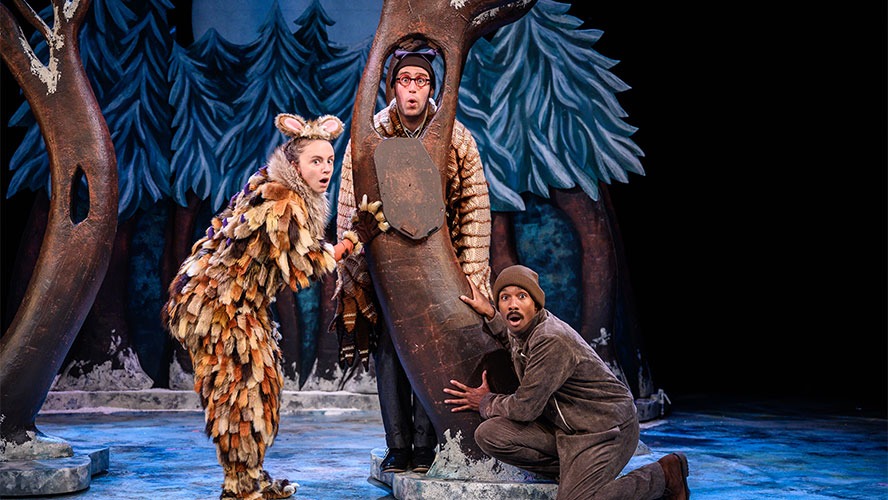 Harriet Waters, Maxwell Tyler, and Samuel Tracy pose together, smiling in a playful outdoor setting.