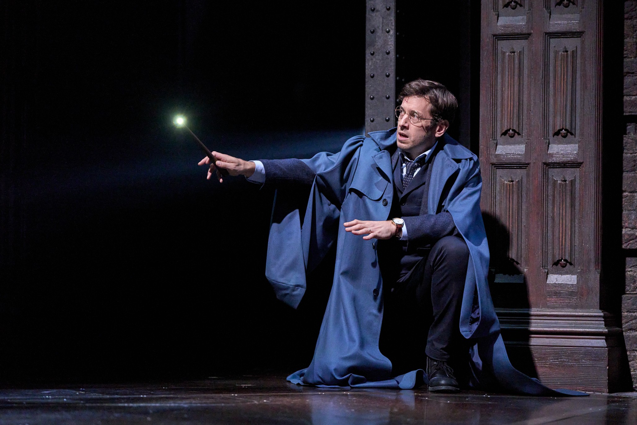 A dramatic scene from Harry Potter and the Cursed Child, featuring actors in costume on stage.