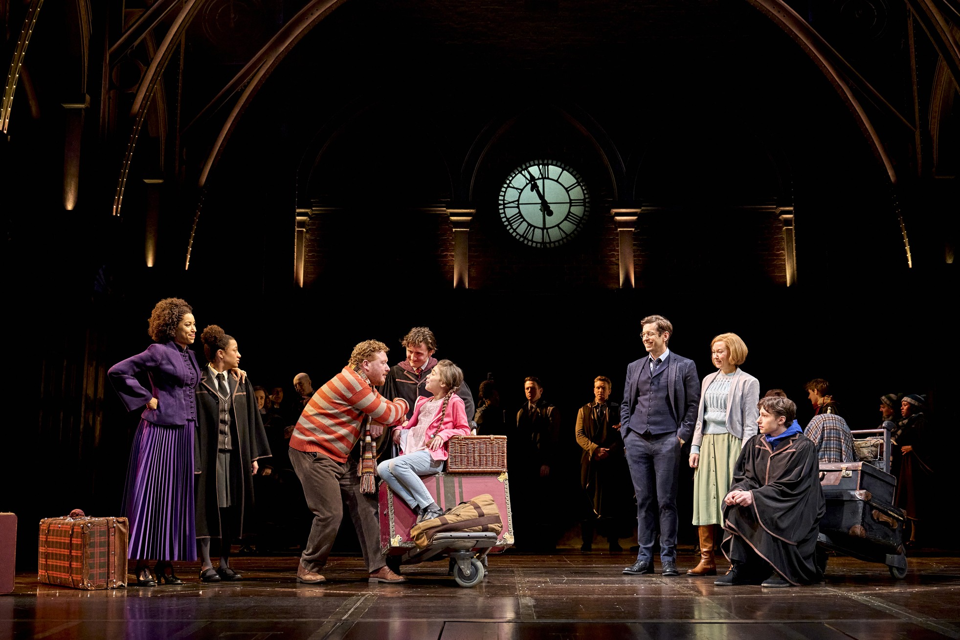 A scene from Harry Potter and the Cursed Child, featuring characters in dramatic poses on stage.