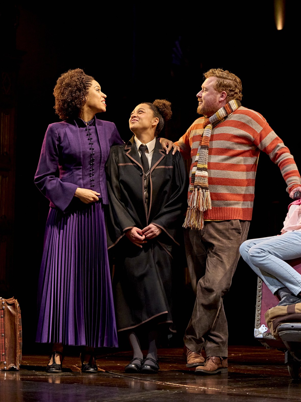 Scene from Harry Potter and the Cursed Child, featuring actors in elaborate costumes on stage.