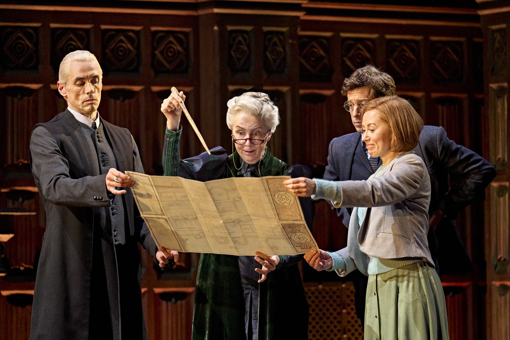 A scene from Harry Potter and the Cursed Child, featuring characters in dramatic costumes on stage.