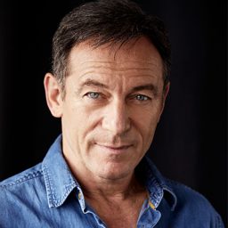 Headshot of Jason Isaacs, featuring a serious expression and dark hair against a neutral background.