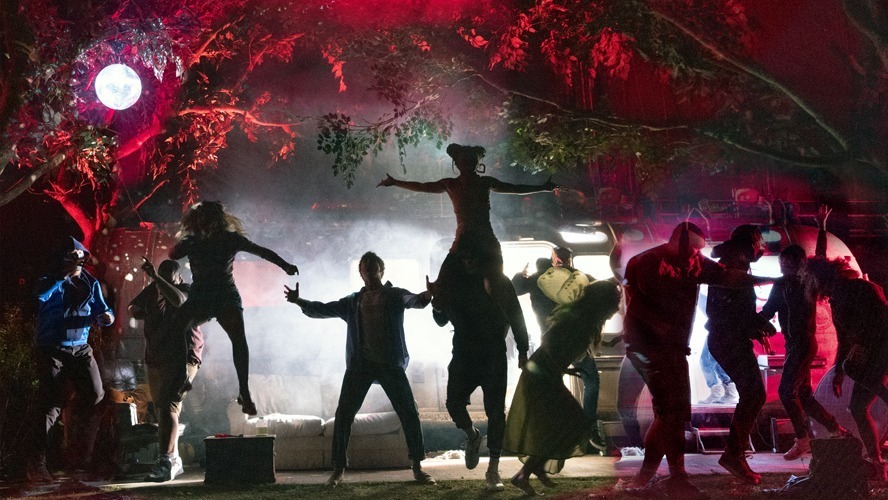 A stage scene from "Jerusalem" at the Apollo Theatre, featuring actors in dramatic poses.