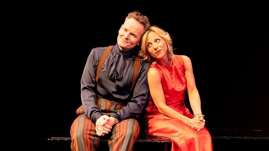 Liza Pulman and Jow Stilgoe smiling together at an event, dressed in formal attire.