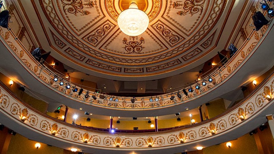 Interior view of the Lyric Theatre, showcasing ornate architecture and elegant seating arrangements.