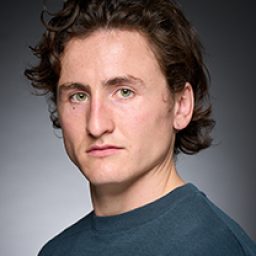 Matty Loane as a character in Harry Potter and the Cursed Child, wearing wizard robes.
