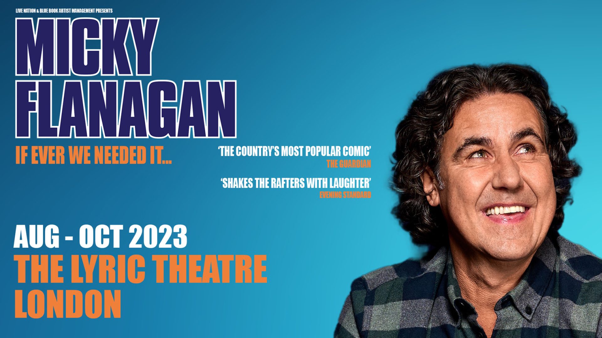 Micky Flanagan performing on stage, with a microphone and audience in the background.