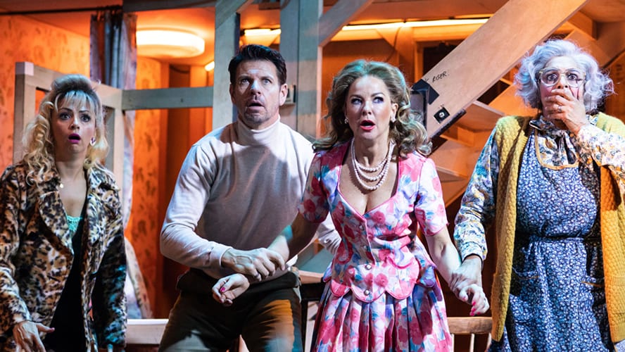Actors performing on stage in a scene from "Noises Off" at the Garrick Theatre.
