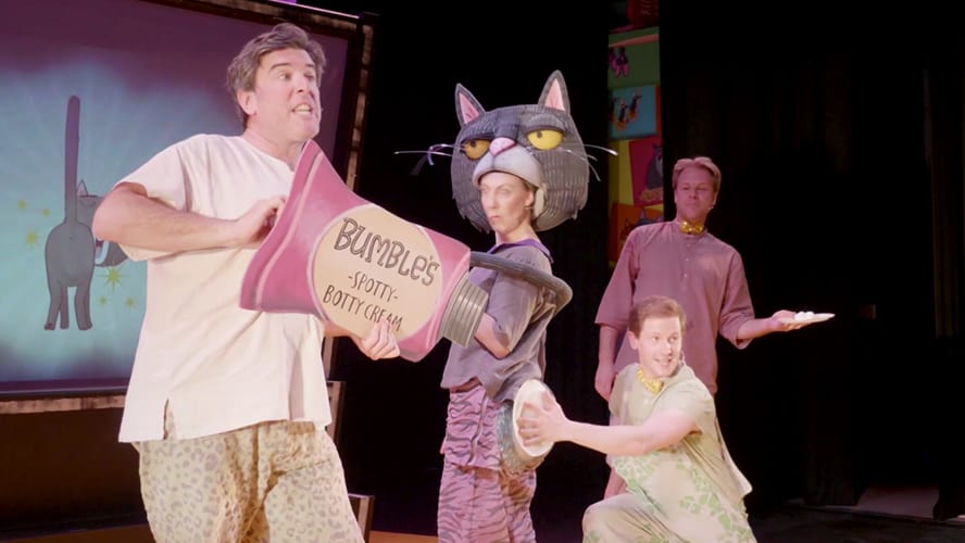 Colourful characters from "Oi Frog and Friends" performing on stage at the Lyric Theatre.