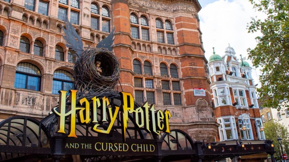 Exterior view of the Palace Theatre, featuring a marquee for "Harry Potter and the Cursed Child.
