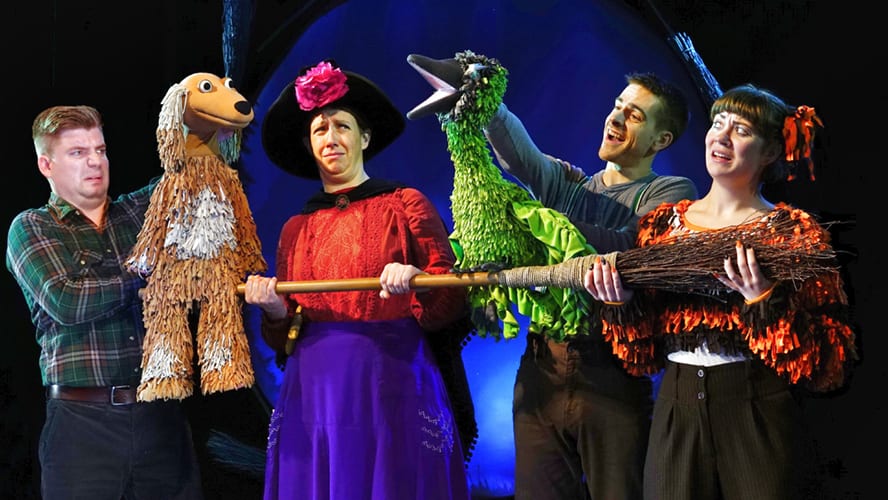 A whimsical scene featuring a witch, a cat, and various animals on a broomstick.