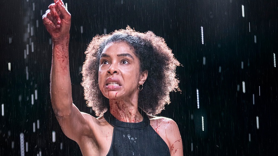 Sophie Okonedo as Medea, wearing a dramatic costume, performing on stage at Soho Place.