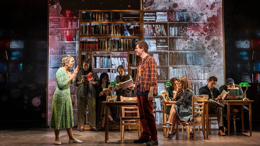The cast of The Time Traveller's Wife poses together on stage at the Apollo Theatre.