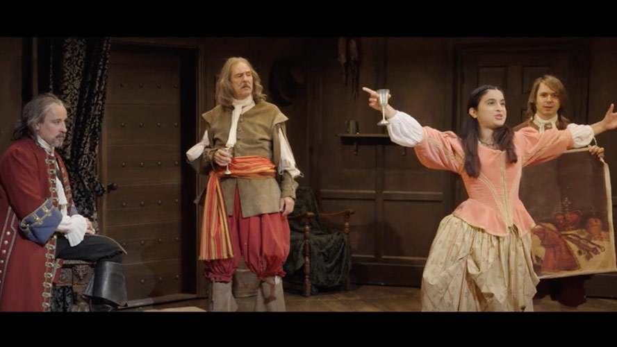 Audience members reacting with excitement while watching a video about the Crown Jewels.