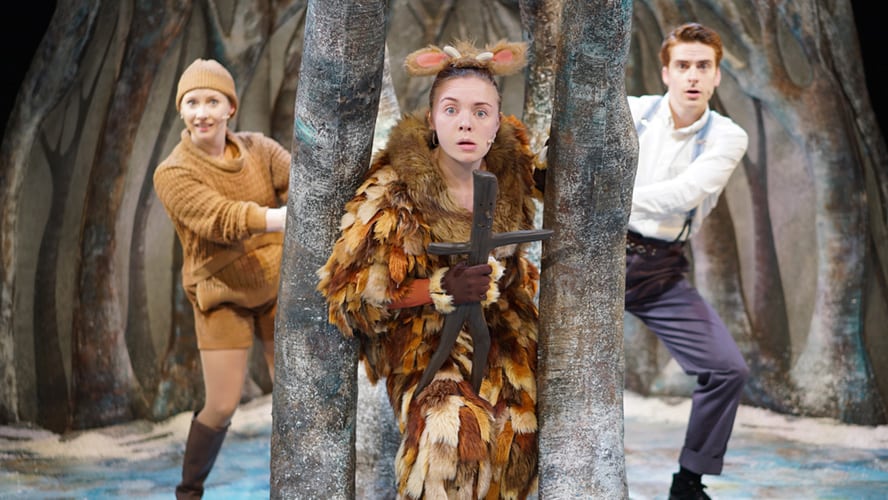 The Gruffalo's Child performing on stage, surrounded by vibrant set designs and colourful lighting.