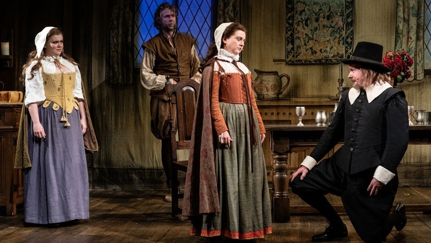 Cast members of The Upstart Crow pose together on stage at the Apollo Theatre.