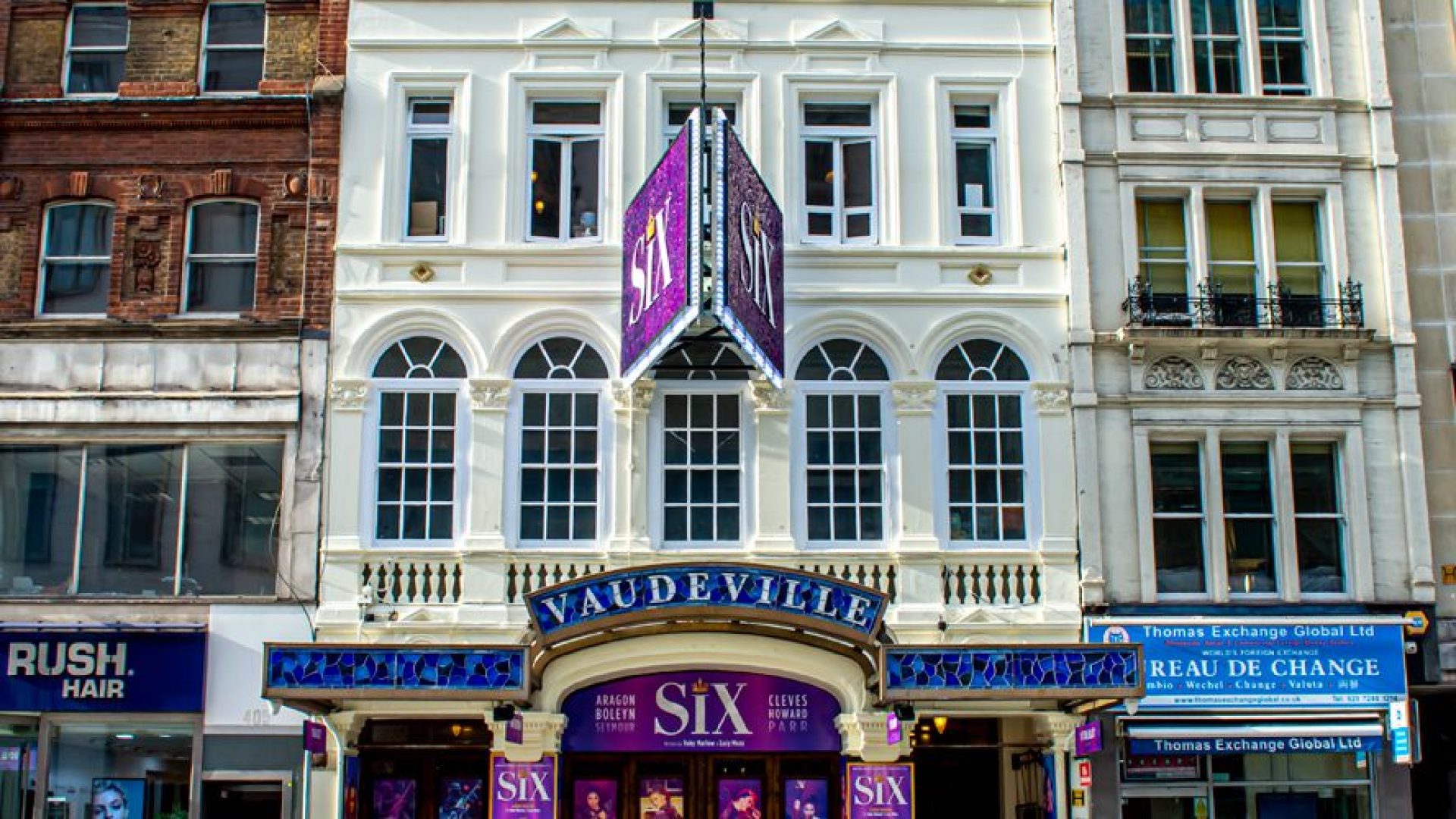 Elegant façade of the Vaudeville Theatre, featuring ornate architectural details and a marquee.