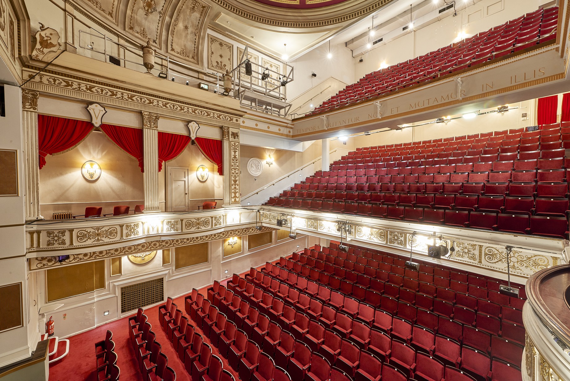 Exterior view of the Vaudeville Theatre, showcasing its ornate architecture and illuminated marquee.