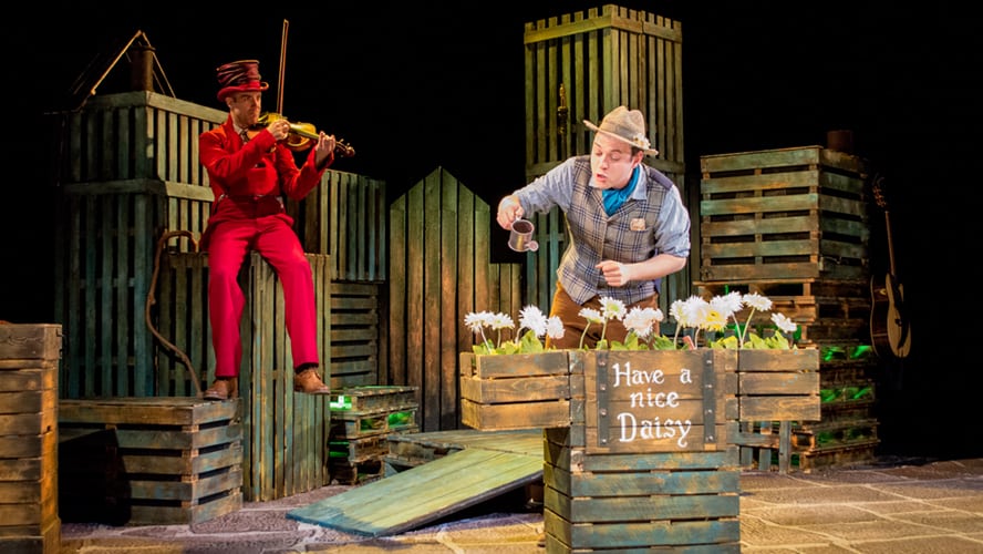A vibrant stage scene from Wilde Creatures at the Vaudeville Theatre, featuring colourful costumes and dramatic lighting.