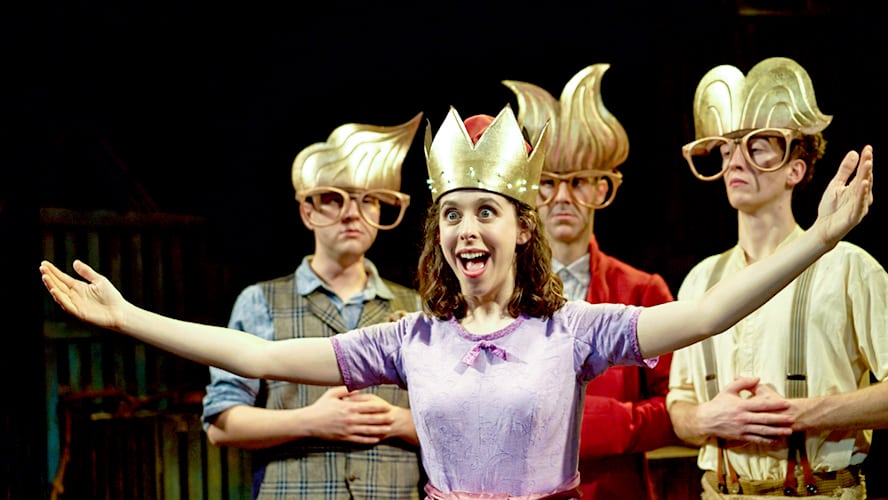 A vibrant stage scene from the Wilde Creatures show, featuring performers in colourful costumes.