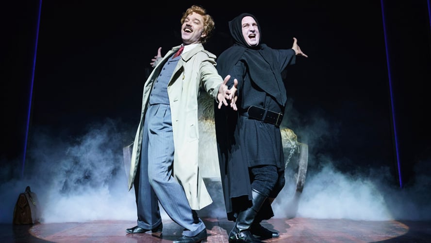 A scene from Young Frankenstein featuring characters in period costumes and theatrical lighting.
