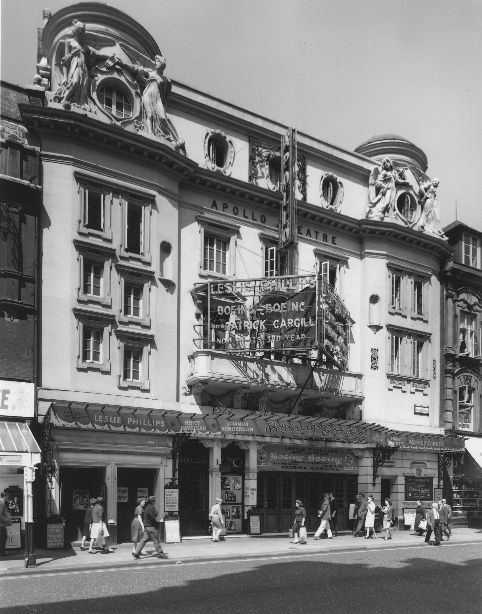 Exterior view of the Apollo Theatre, showcasing its ornate architecture and illuminated marquee.