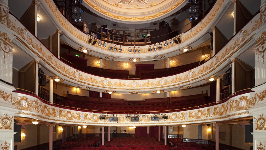 Garrick Theatre's exterior featuring a classic façade, marquee lights, and decorative architectural details.