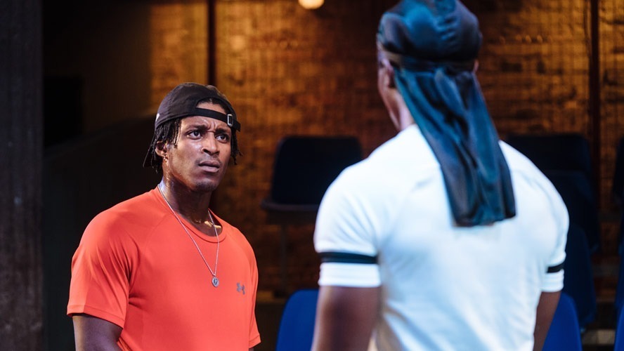 Francis Lovehall and Kedar Williams-Stirling performing in "Red Pitch" at Bush Theatre.