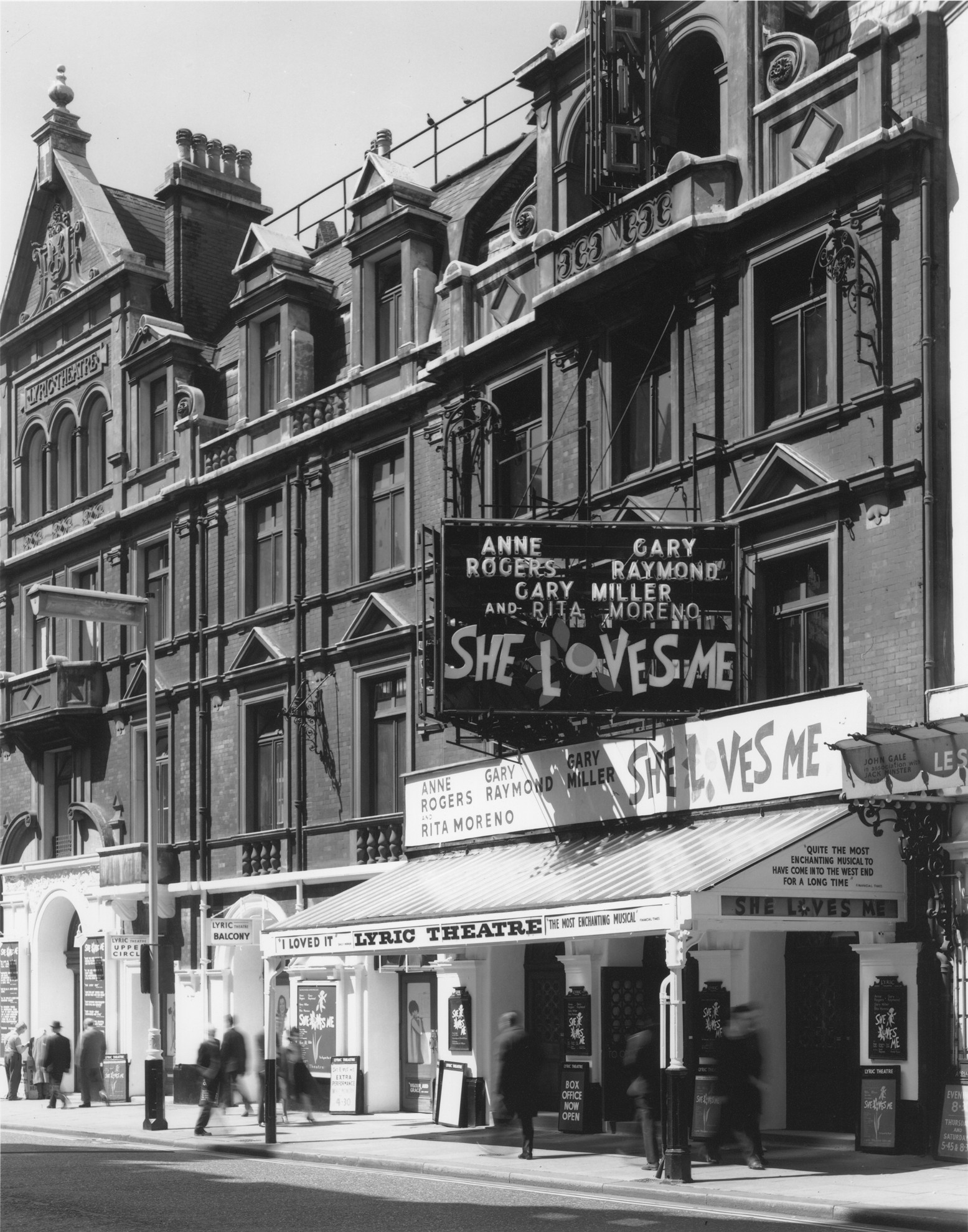 Exterior view of the Lyric Theatre, showcasing its ornate architecture and illuminated marquee.