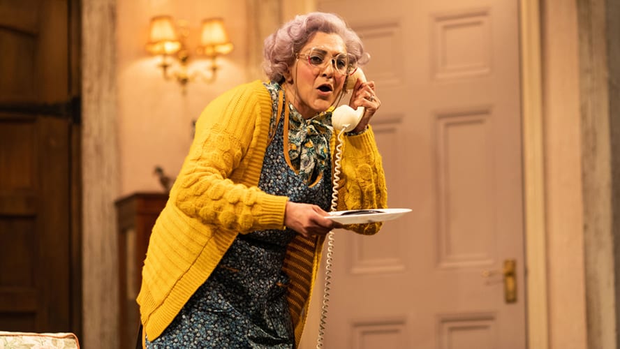 A stage scene from "Noises Off" at Lyric Hammersmith Theatre, featuring actors in a comedic pose.