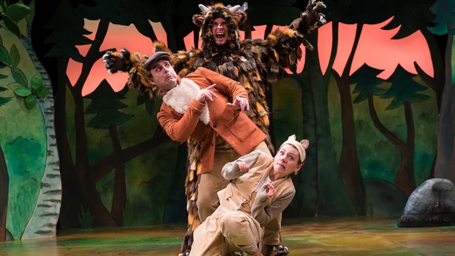 A scene from "The Gruffalo" featuring a large, friendly Gruffalo character in a forest setting.