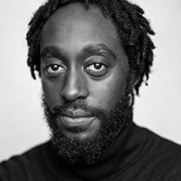 Black and white portrait of Ivanno Jeremiah, featuring a thoughtful expression and soft lighting.